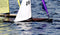Wooden Sailboat Models: A Close-Up of One of Our Model Boats Sailing on a Lake