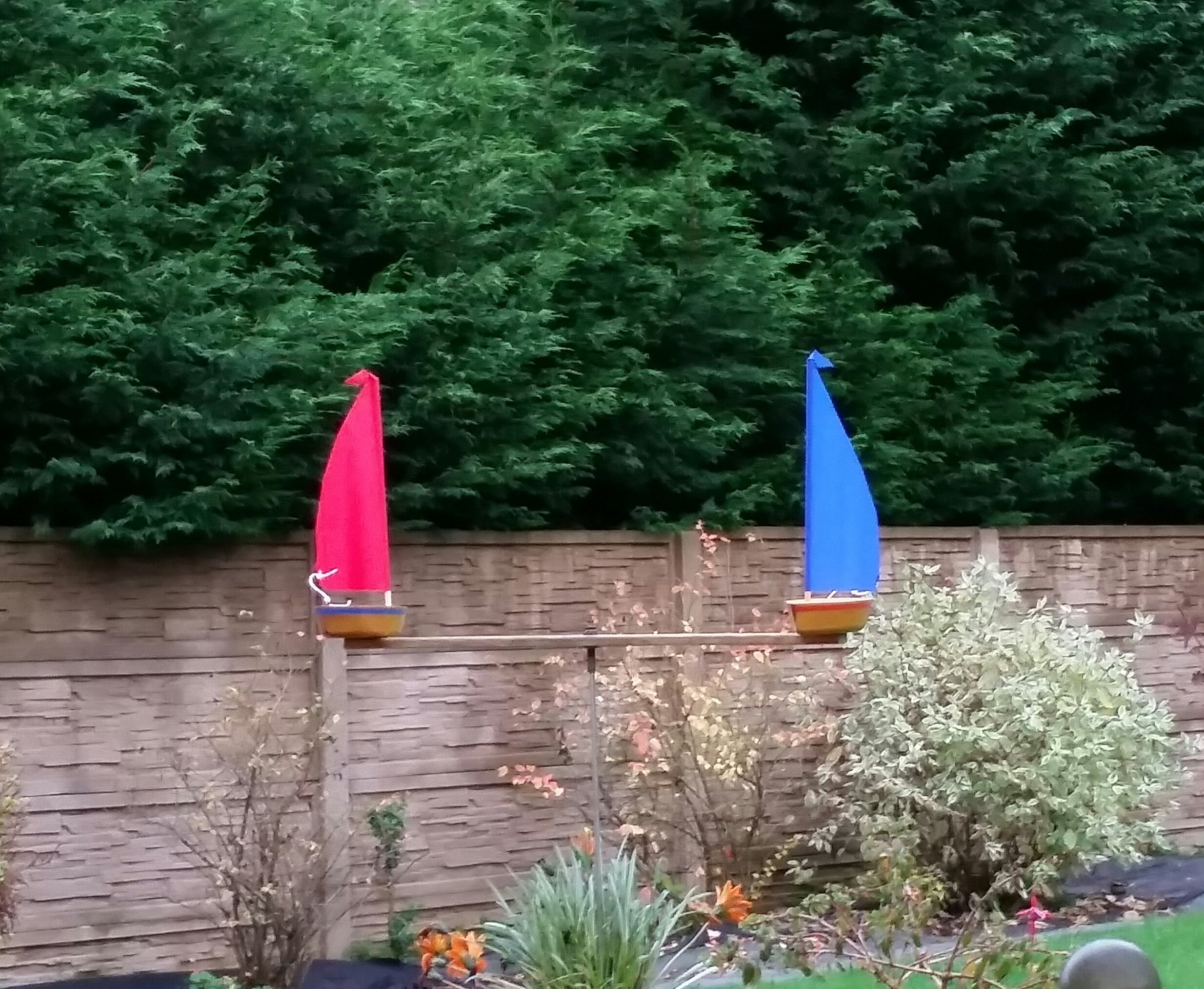 WindRacer Sailboat Whirligig: Handcrafted Garden Art & Kinetic Wind Spinner