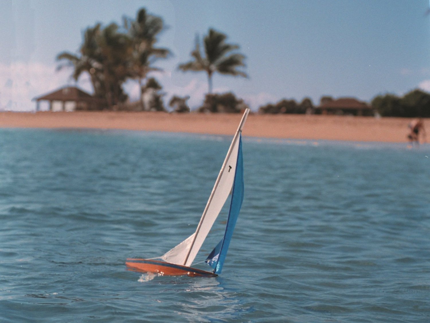 Wooden Toy Sailboat Sailing in the wind