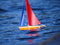 12 inch Wooden Toy Sailboat sailing in water