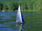 Wooden Toy Sailboat T15 Racing Sloop Sailing on a lake