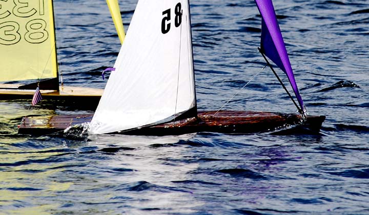 Wooden Sailboat Models: A Close-Up of One of Our Model Boats Sailing on a Lake
