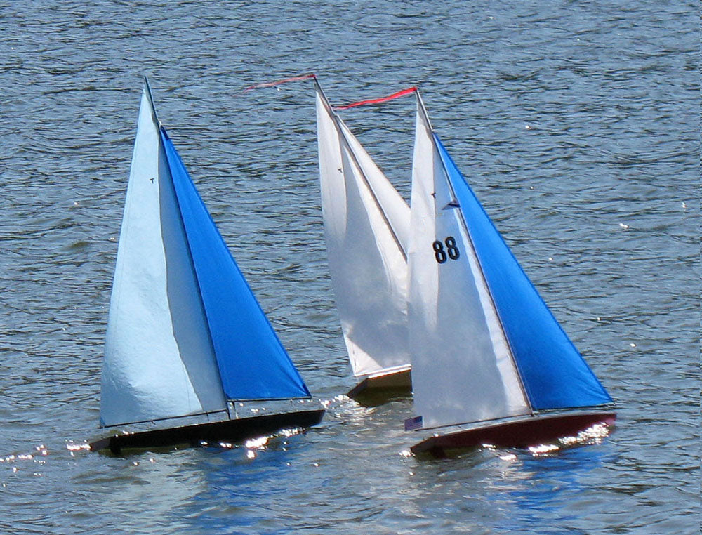 RC Sailboat Racing: A group of Model Sailboats at a Remote Control Boat Race